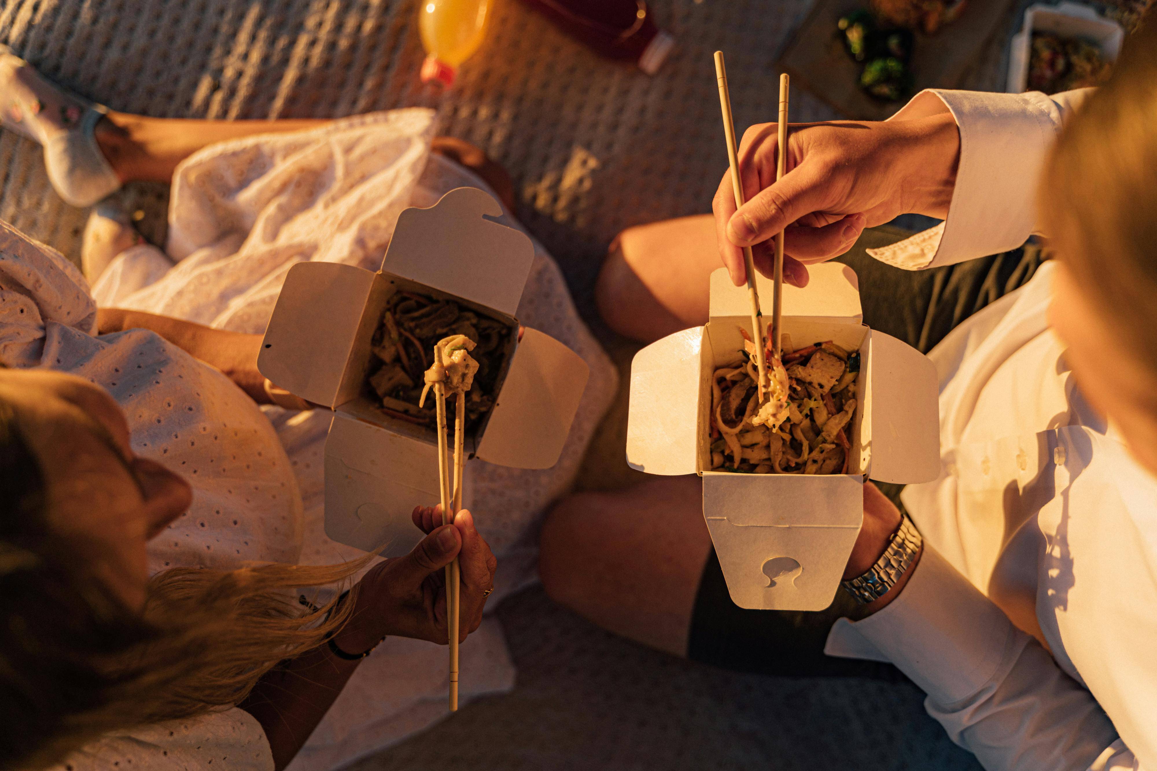 2024 Sales Tax Changes: What Your Business Needs to Know | TaxValet | Sales tax done for you | Image of people eating Chinese take out on a picnic blanket